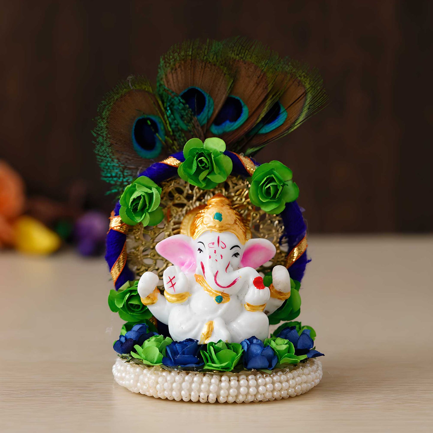 Lord Ganesha Idol on Handcrafted Floral Plate with Peacock Feather