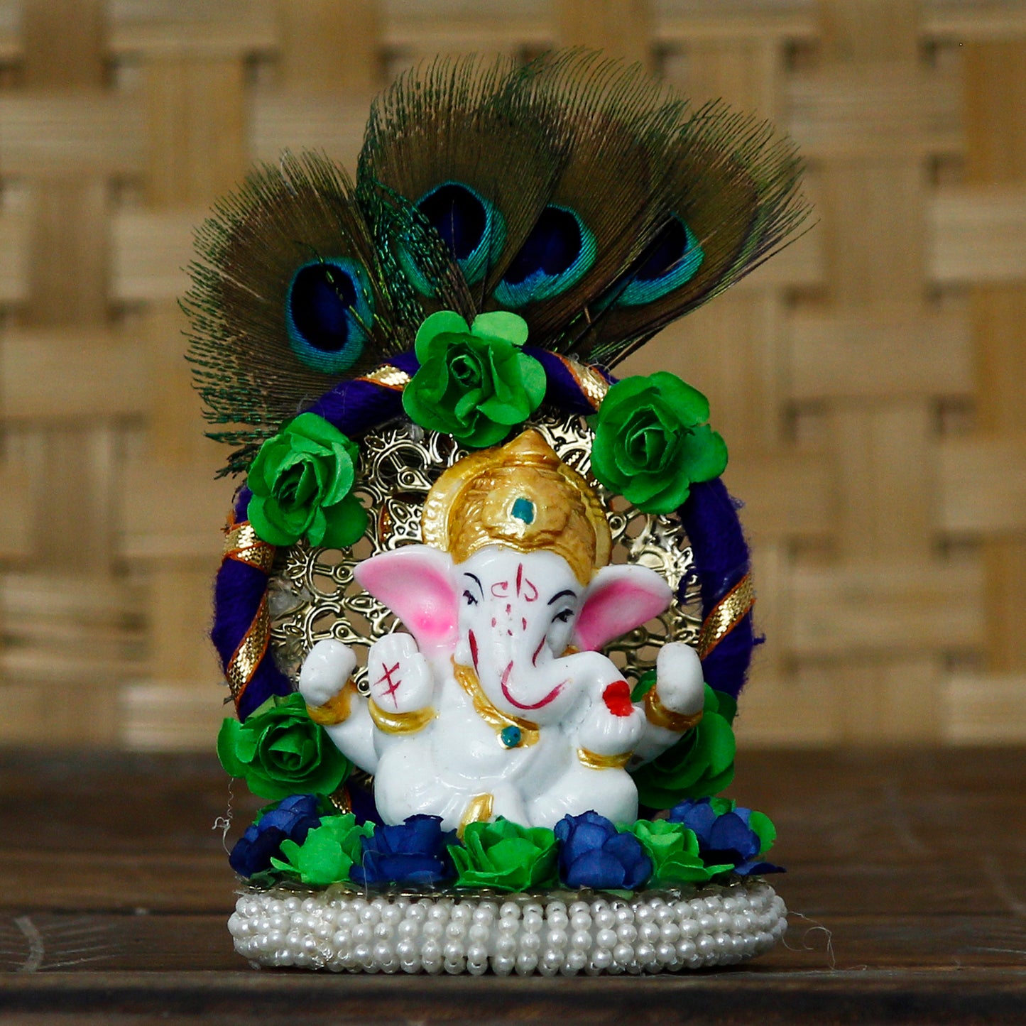 Lord Ganesha Idol on Handcrafted Floral Plate with Peacock Feather